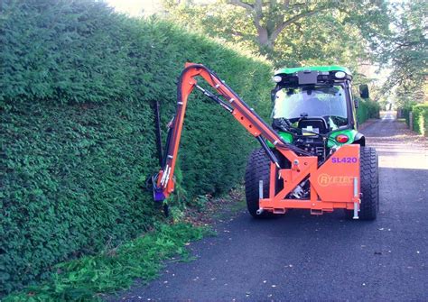 hedge end mini digger & plant hire|compact tractor with hedge trimmer.